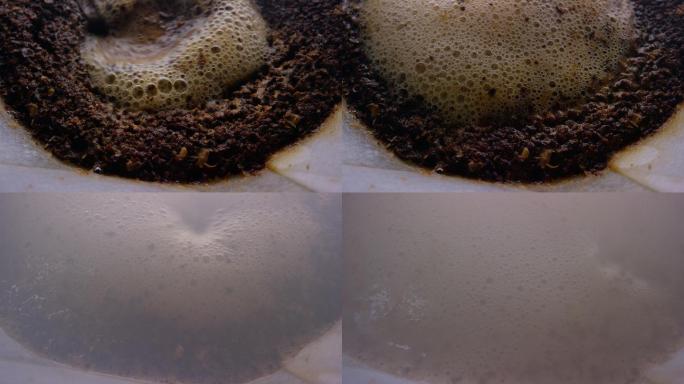 热水倒灌咖啡机中纸质过滤器中新鲜咖啡渣的宏观拍摄