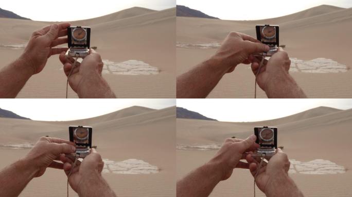沙漠中用指南针确定方向的人手细节