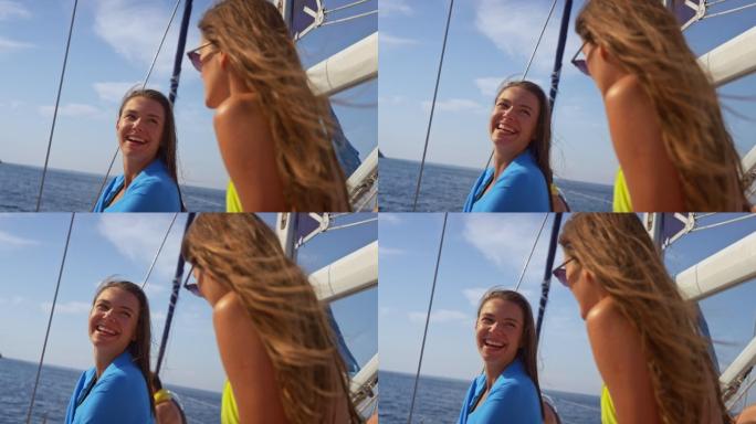 斯洛·莫两个年轻女子在阳光下的游艇上谈笑风生