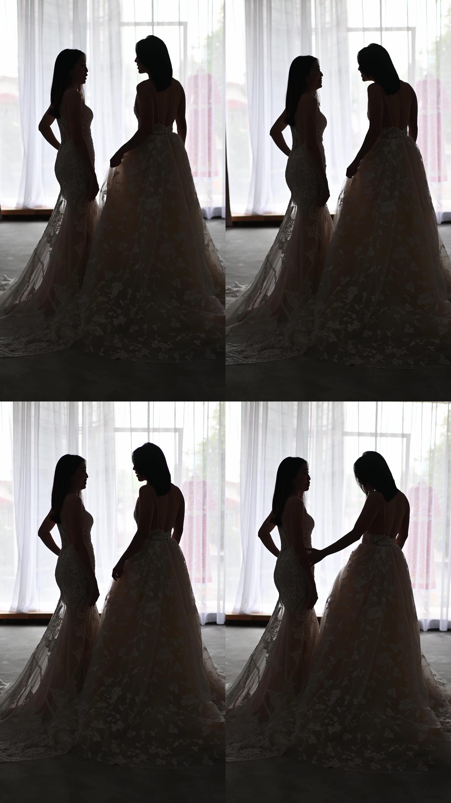 侧影后视图：穿着婚纱的亚洲中国美女在婚纱店摆姿势，在婚纱店微笑