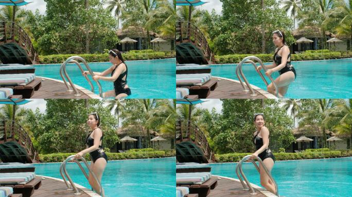 无忧无虑的女性在游泳池中放松暑假理念