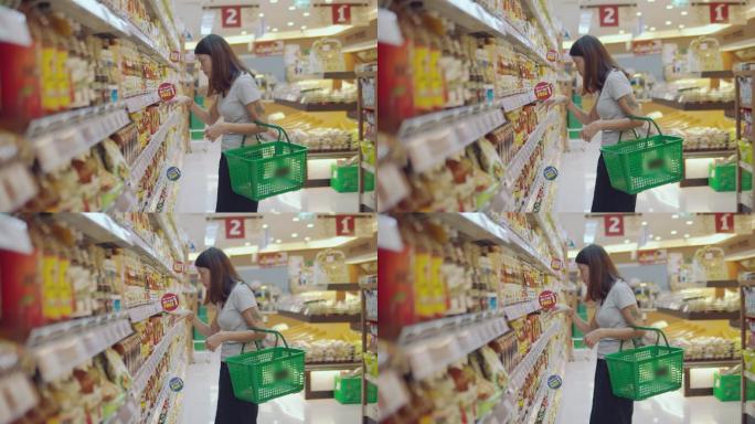 杂货店的亚洲妻子超市选购