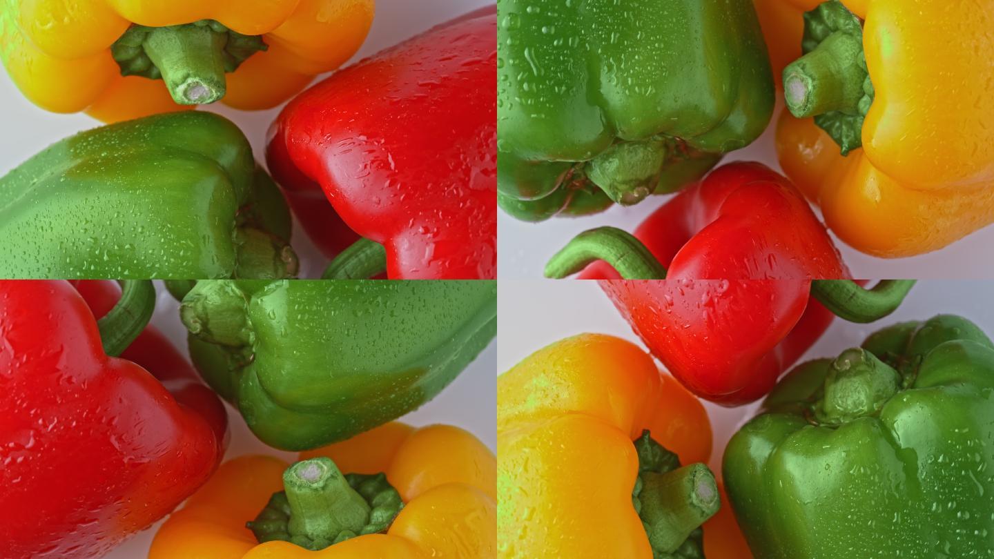 SLO MO黄色、绿色和红色甜椒在白色背景上旋转