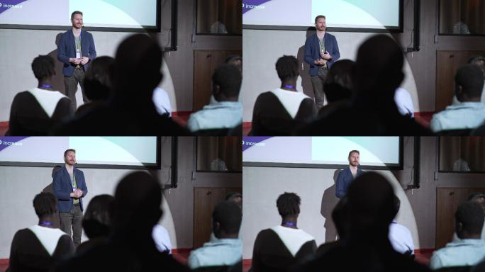 在商务会议活动上做演讲的男性演讲者