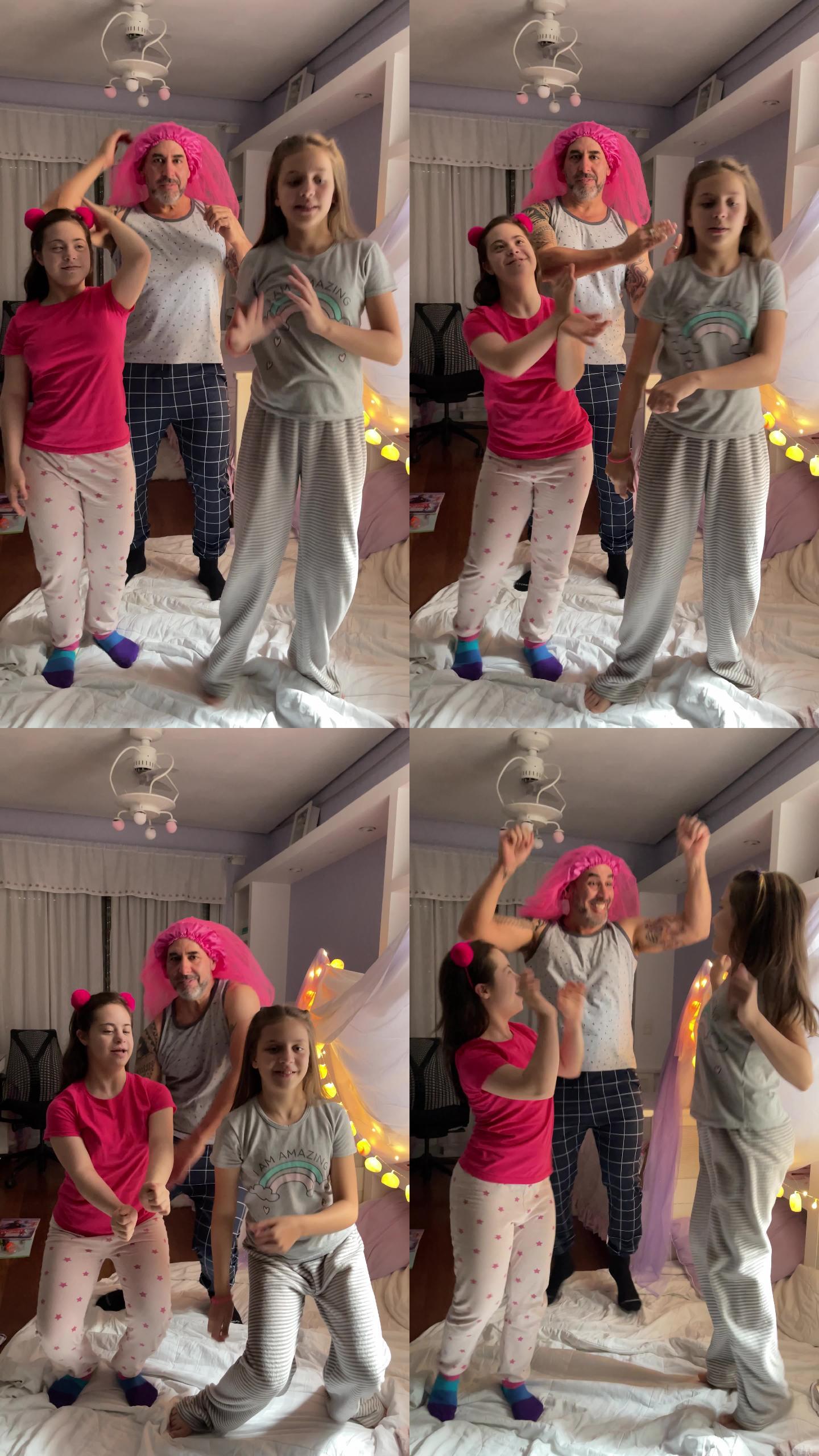 父亲和女儿在家里的卧室里为社交媒体跳舞-有特殊需要的女孩-手机摄像头视角