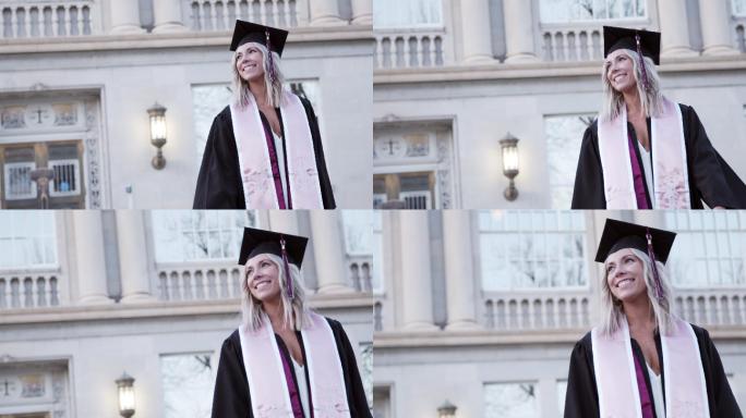一个快乐的大学毕业生回头仰望的慢镜头