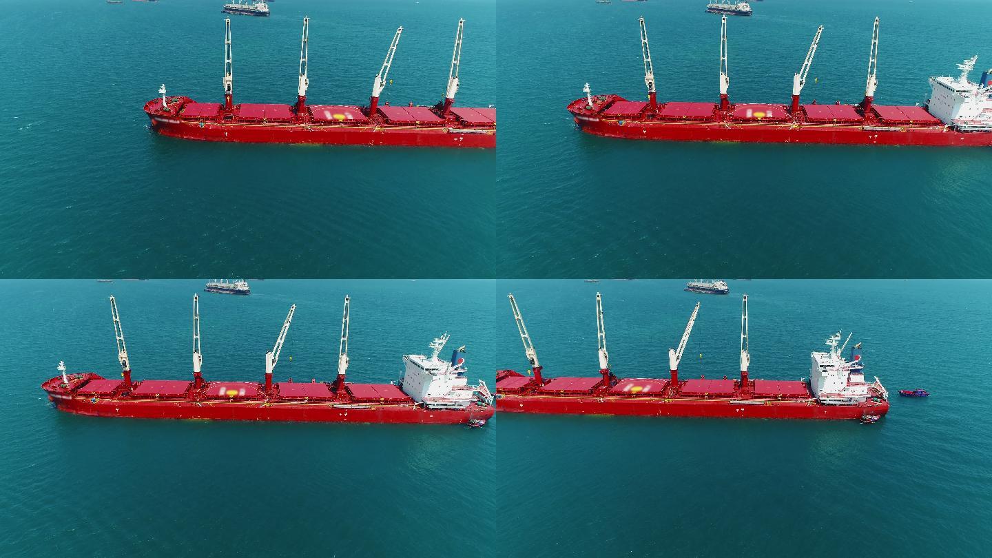 海上作业煤炭货船货轮特写红色大船海面