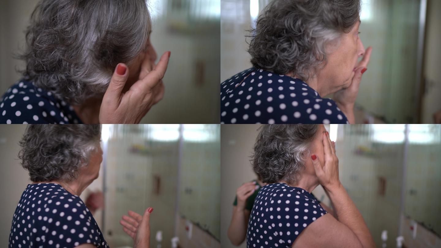 一位老妇人在浴室里涂抹身体水分，她的孙女到达