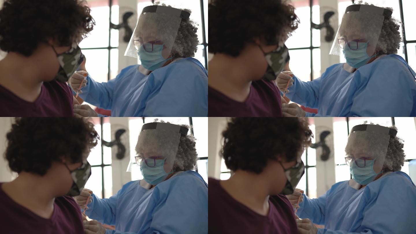少年男孩接种疫苗-戴口罩