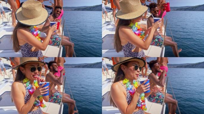 当她们坐在游艇边上玩的时候，女人们和朋友一起举杯