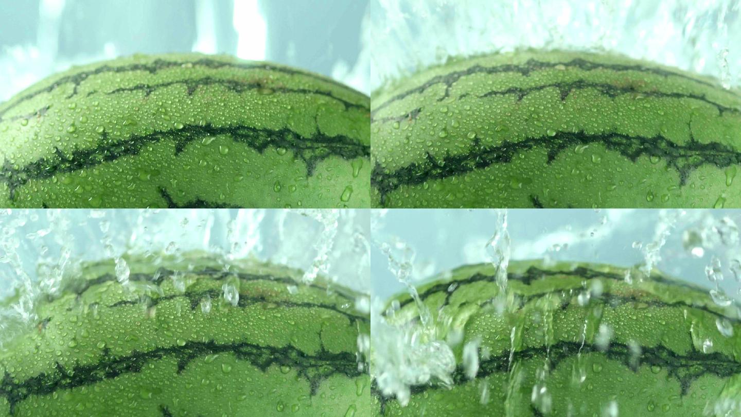 西瓜被水冲击溅起水花