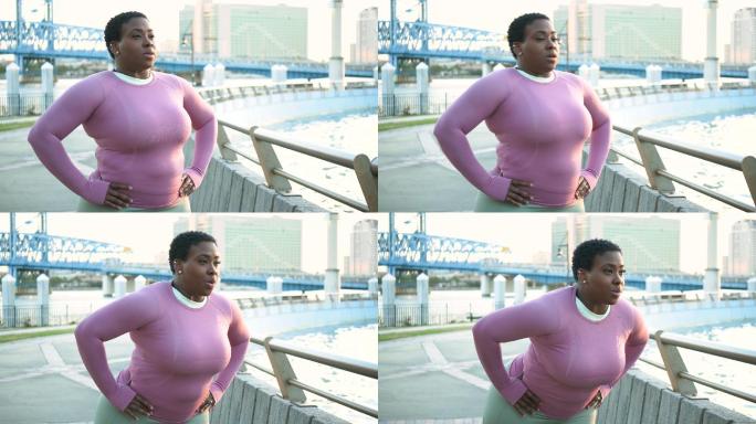 非裔美国妇女在城市公园伸展身体