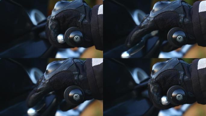 一名男子戴着黑色皮革手套启动发动机的特写镜头。库存视频土耳其，摩托车，起步，摩托车手，发动机