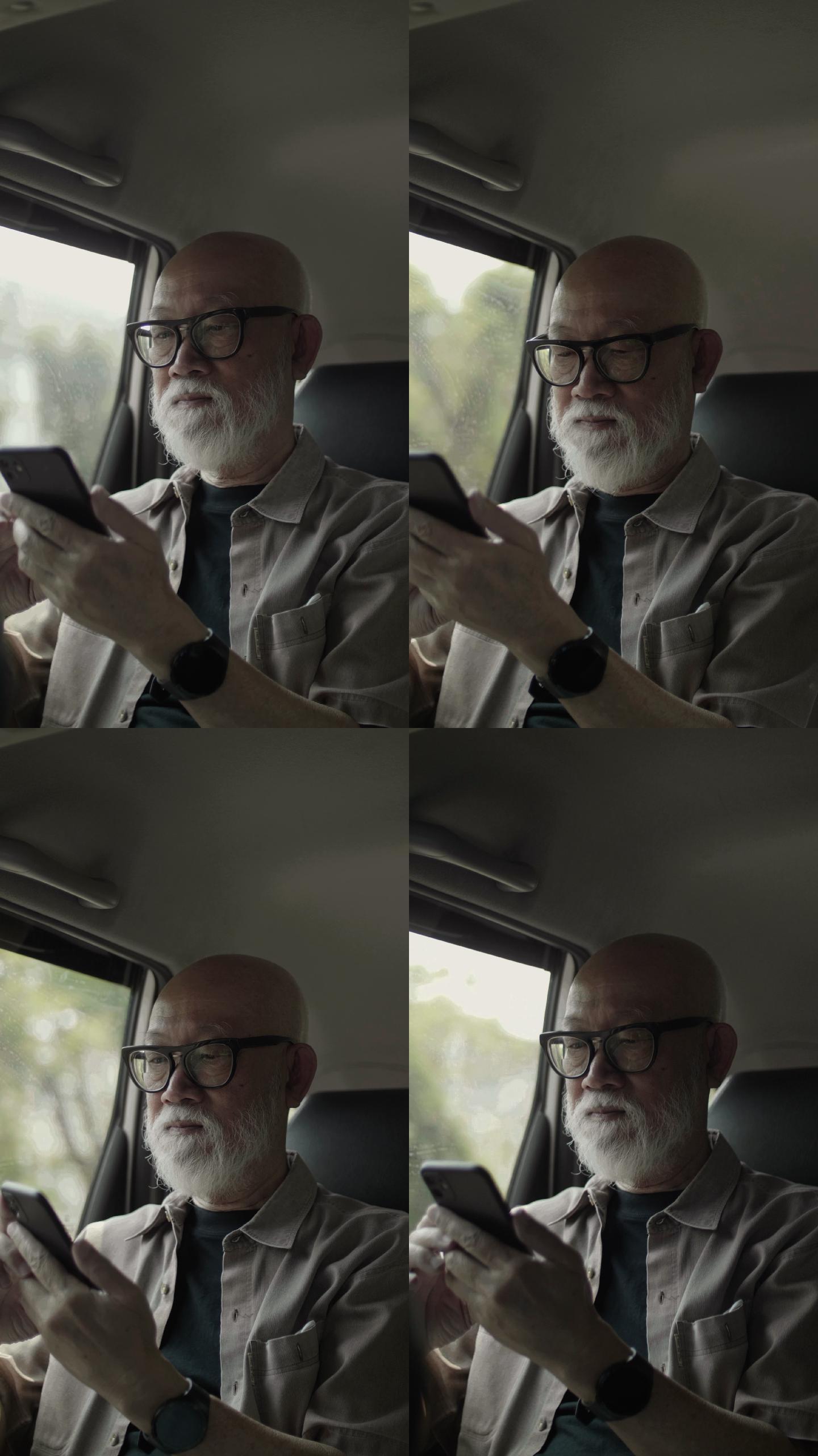 垂直视频格式：活跃的老人在车内使用手机