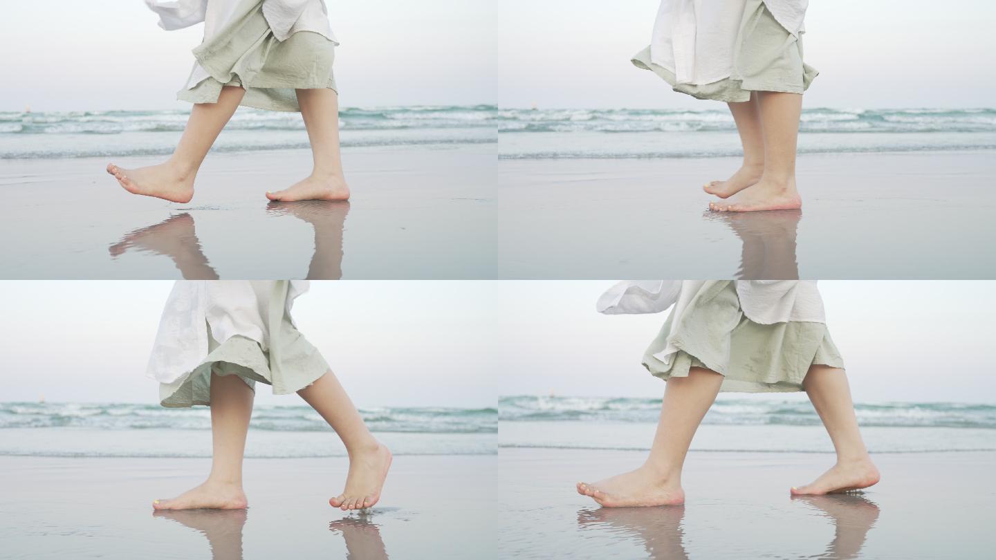 在海滩上行走的女人腿
