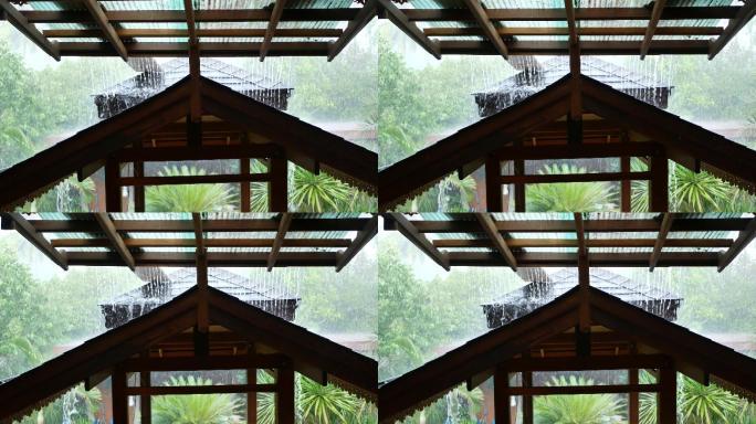 大雨落在屋顶上雨景雨季热带雨季