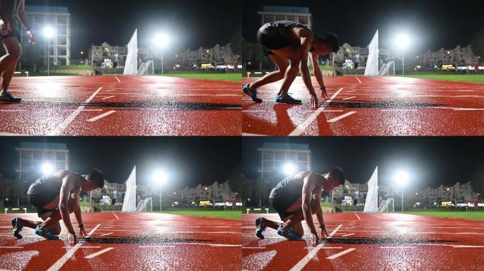 黄昏时分，中国亚裔男子运动员在体育场男子跑道上慢跑