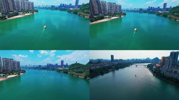 广西柳州柳江上的水上公交和城市建筑风光
