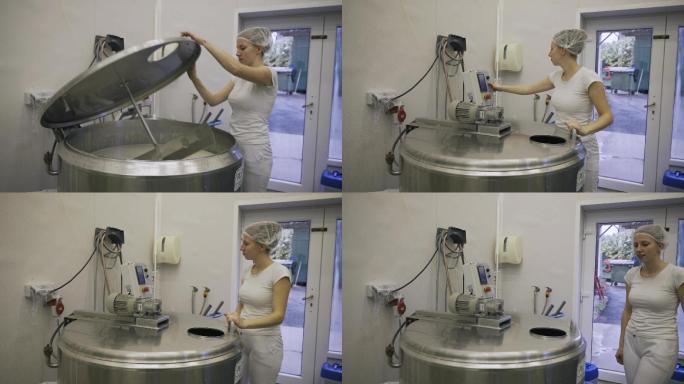 在乳品厂操作机器的白人女性工人