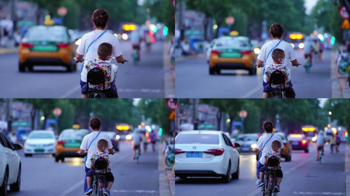 骑自行车带小孩的女人