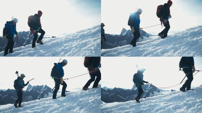 登山队登上山顶。带绳索和设备的冬季冒险
