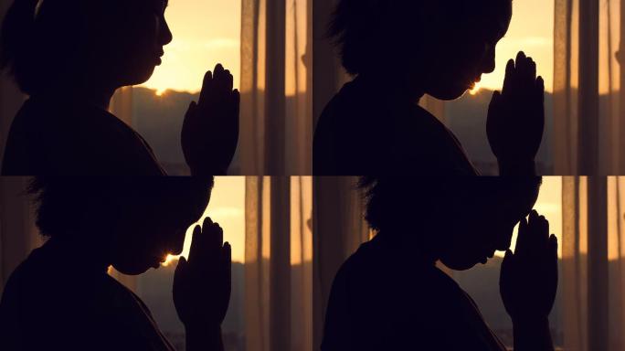 日落时祈祷的女人许愿愿望哲学