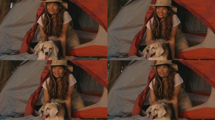 野营中美丽女孩和小狗的特写照片