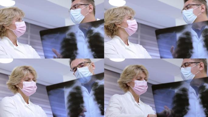 医生戴防护面罩和检查X射线的低角度视图，慢镜头
