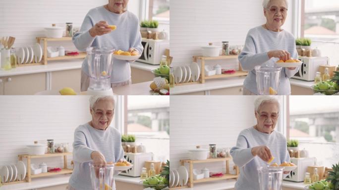 亚洲老年女性，80岁，用电动搅拌机自己准备水果冰沙，享受健康饮食、侧视、城市生活的老年人、退休后独处
