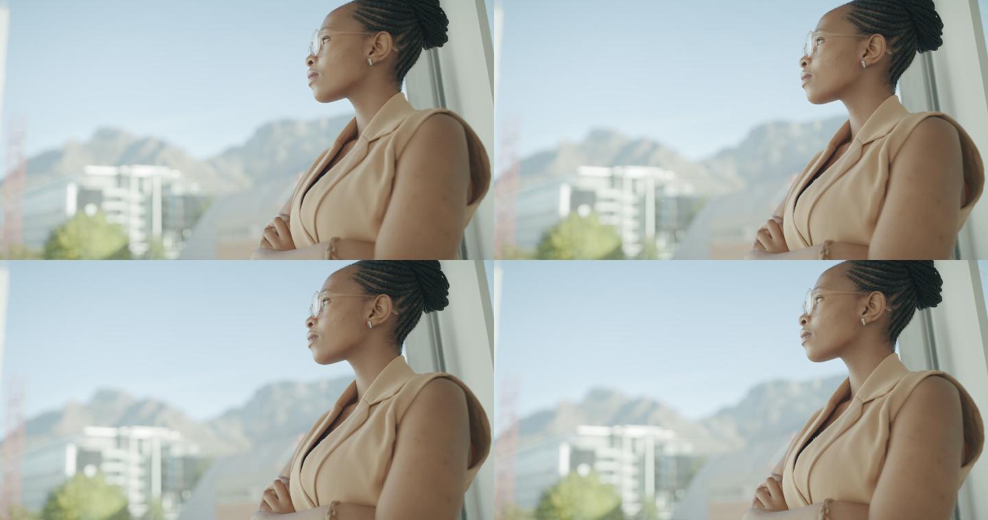 一段4k视频，一位年轻的女商人在现代化的办公室里若有所思地看着窗外