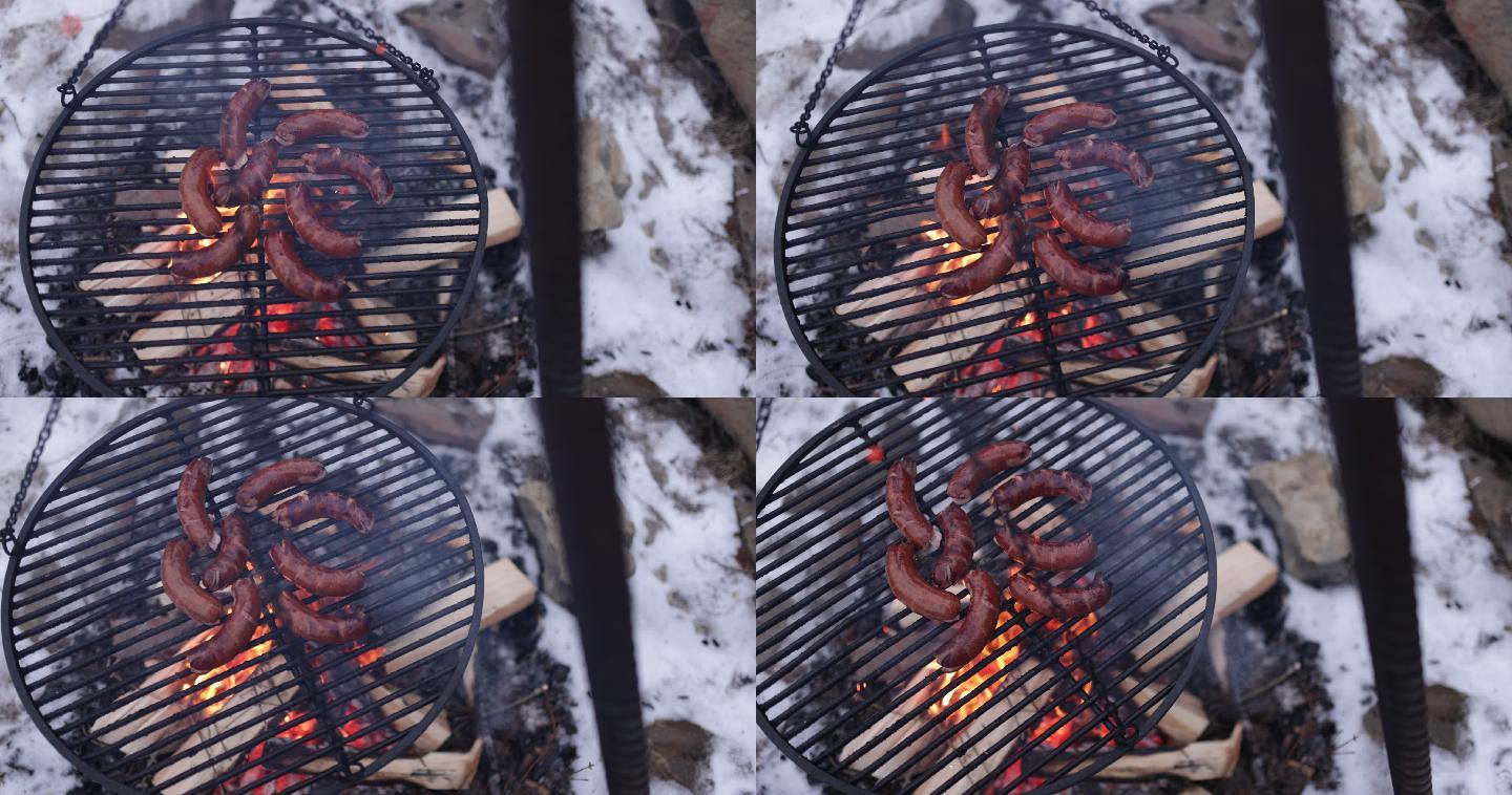 后院篝火上烤香肠的镜头。