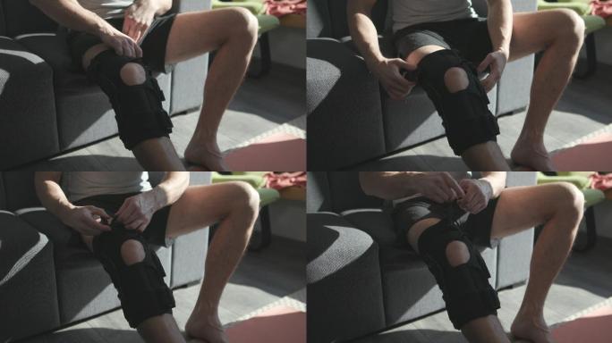 年轻男子运动前戴上膝盖绷带固定器