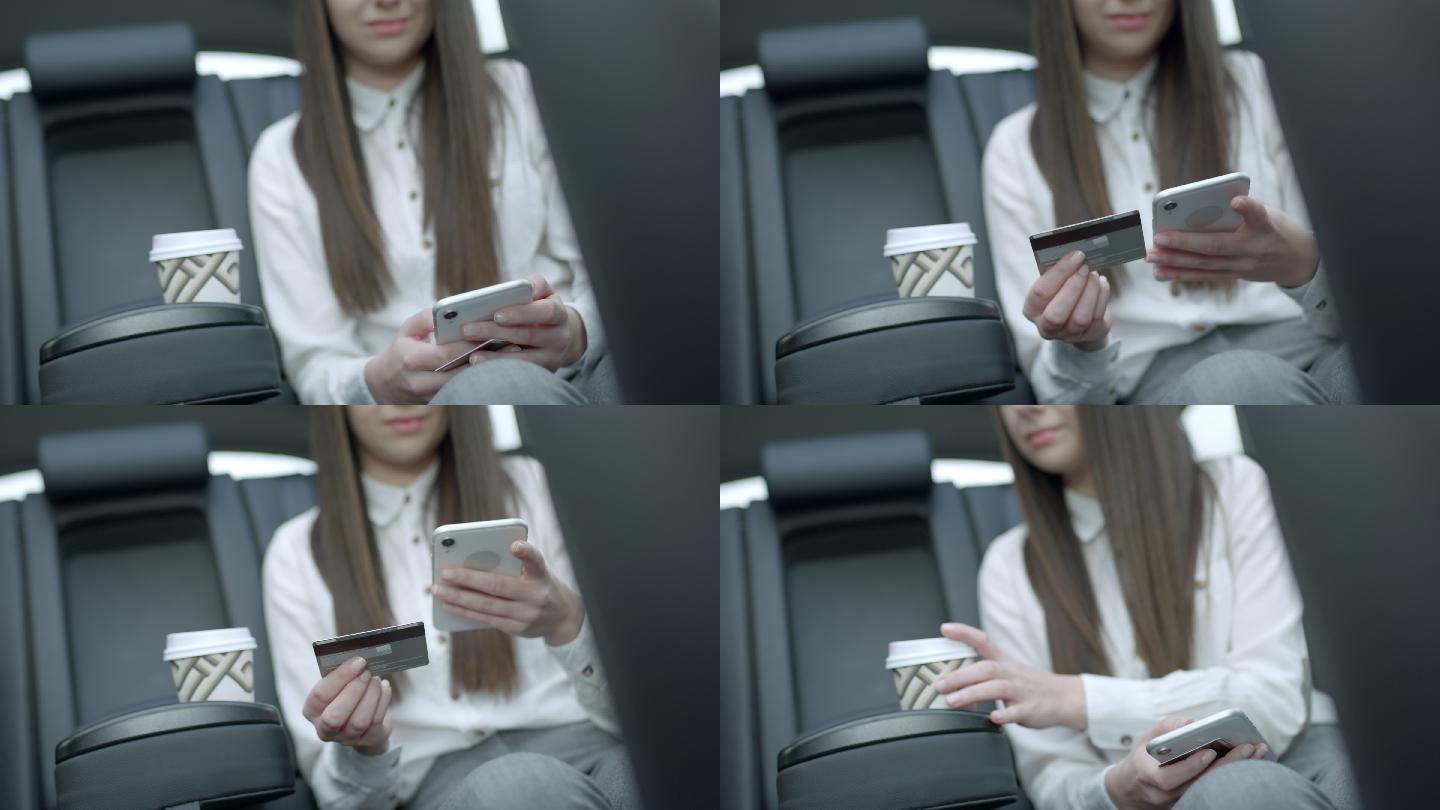 MS年轻女子在众包出租车后座使用智能手机和信用卡