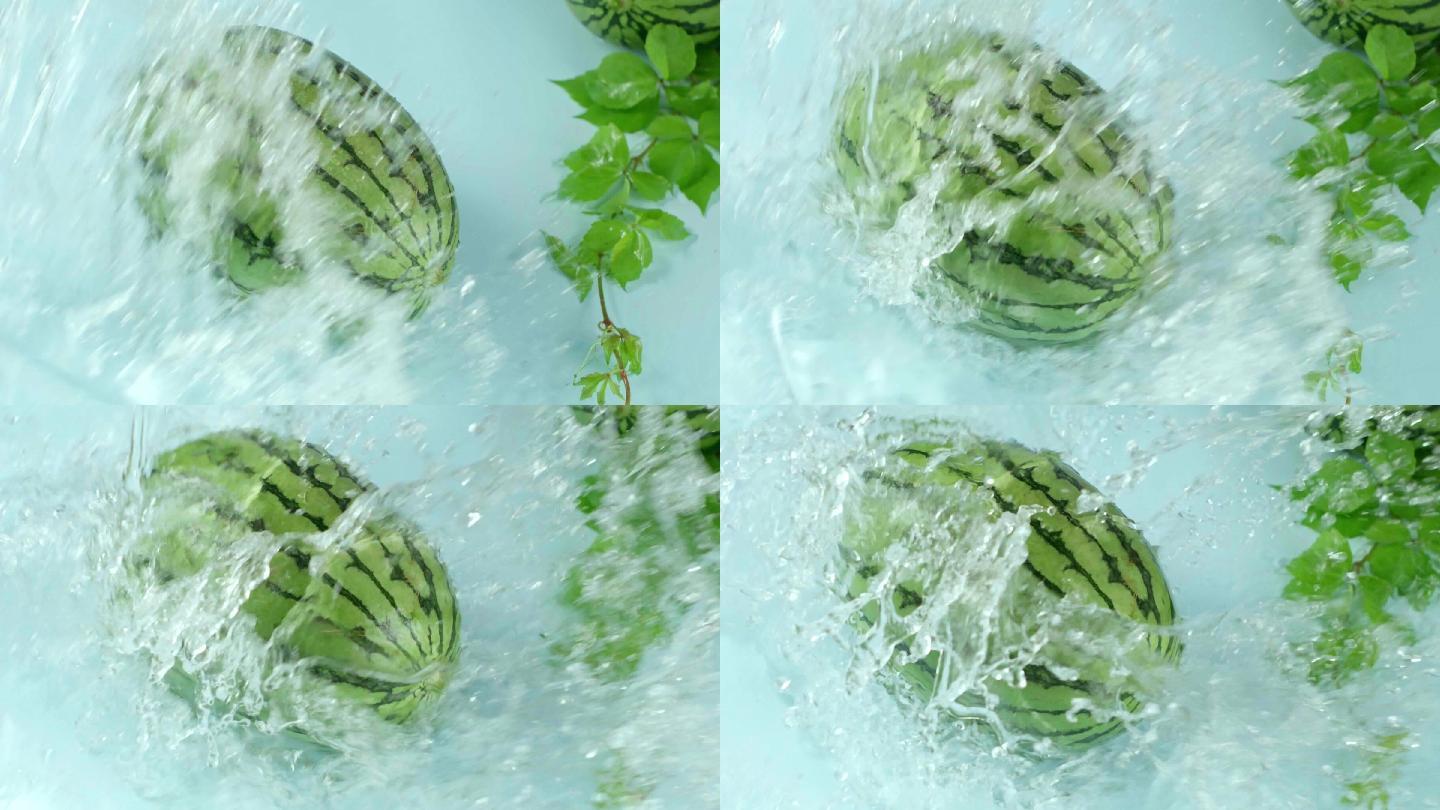 西瓜被水冲溅起水花