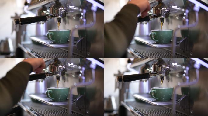咖啡师在专业机器上煮咖啡的特写镜头。