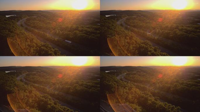 日落时分，在新泽西州I-80高速公路上，借助强烈的动态镜头光斑，在阳光下拍摄全景广角视图。具有下降摄