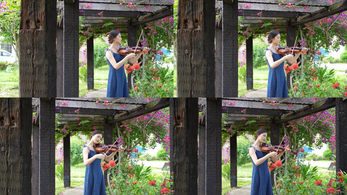 女孩在花园拉小提琴