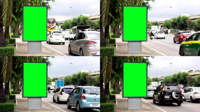 随着时间的推移，广告牌上的绿屏城市街道标志。