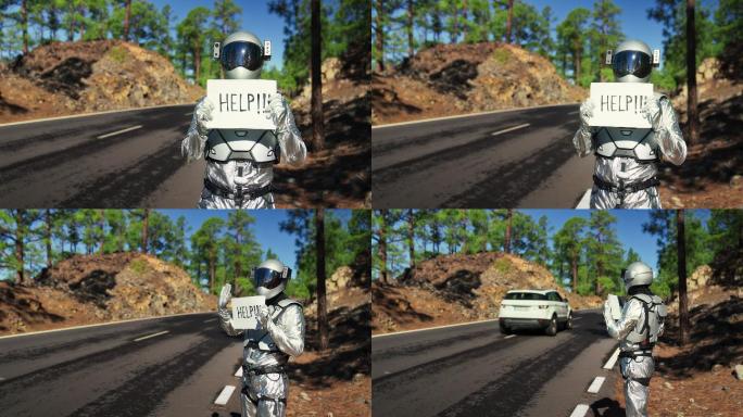 迷路的宇航员正在寻求帮助。在山路上搭便车。持有“帮助”标志