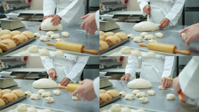 特写镜头：从烤箱中烤出的馒头，在托盘上揉成圆形的面团等待发酵，同时厨师在商业面包房厨房揉捏、揉成圆形