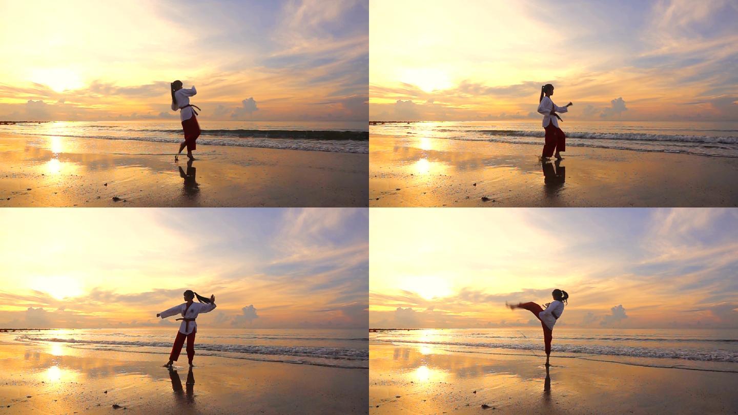 高清超慢镜头：日落时分，年轻女子在海滩上户外练武
