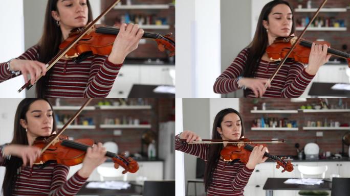 美丽的年轻艺术家在家拉小提琴，完全专注于弓的动作。