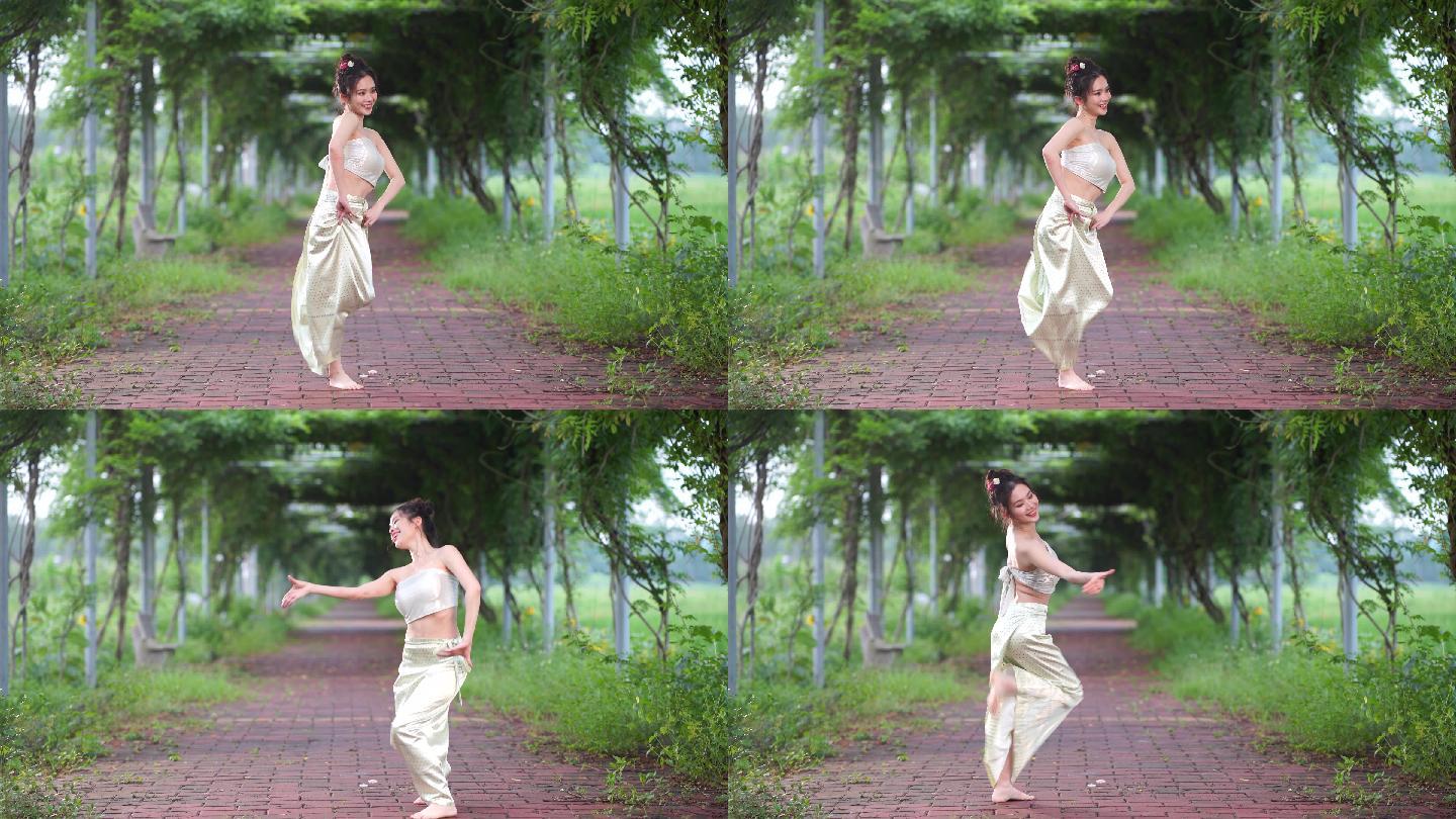 傣族少女在跳传统舞蹈