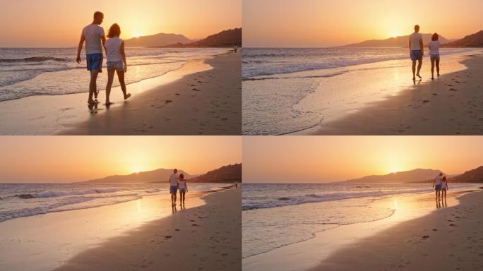 夕阳西下，父女俩在沙滩上散步聊天