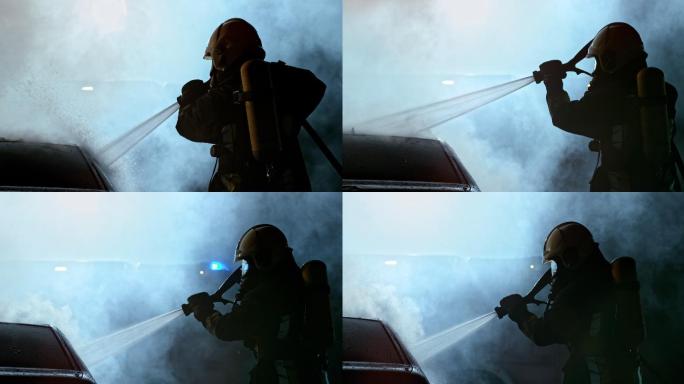 斯洛莫消防队员在夜间用水将烧毁的汽车淋得湿透
