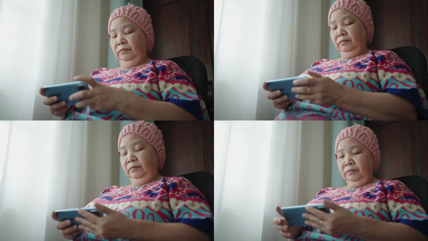 老年女性使用智能手机与癌症作斗争