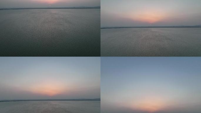 落日余晖，从湖面摇到天空航拍4k原始素材