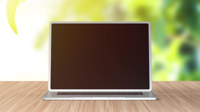 黑屏笔记本电脑站在绿色背景的桌子上。