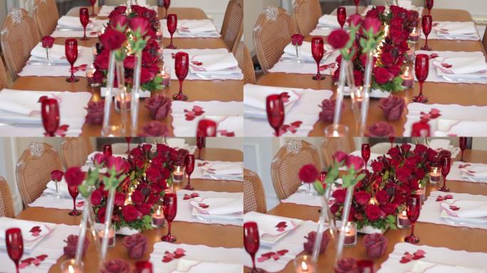 情人节主题的餐盘和餐巾纸架，心和玫瑰空荡荡的餐桌特写视频，疫情期间空荡荡的情人节餐桌慢镜头视频，餐桌