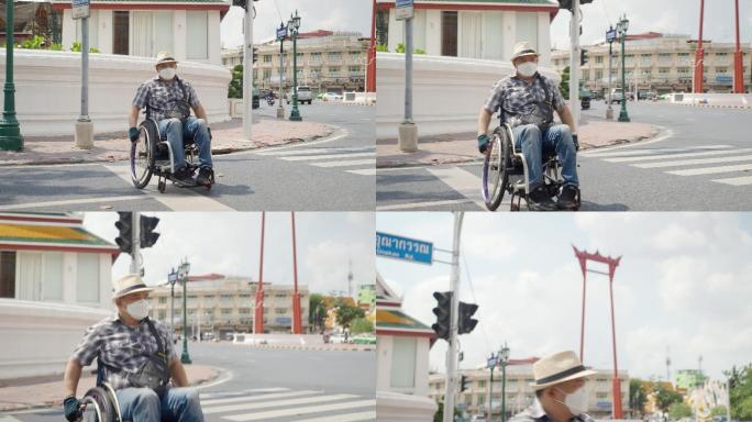 曼谷轮椅旅游地标概念。亚洲男性游客在曼谷的巨型摇摆地标拍照留念
